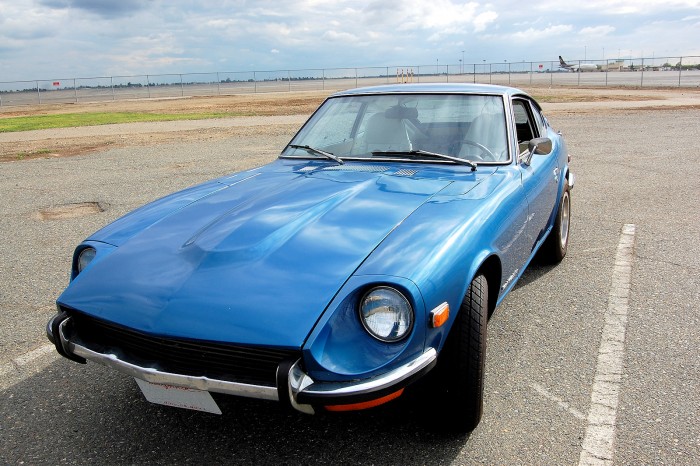 A photo of the front of a Nissan Datsun 240Z with the headlights shown